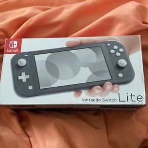 NINTENDO SWITCH LITE GRAY WOTH SD CARD, ANIMAL CROSSING NEW HORIZONS, ZOMBIELAND